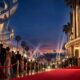 Filmska ilustracija međunarodnog filmskog festivala u Hollywoodu s kinom, crvenim tepihom i projekcijama.